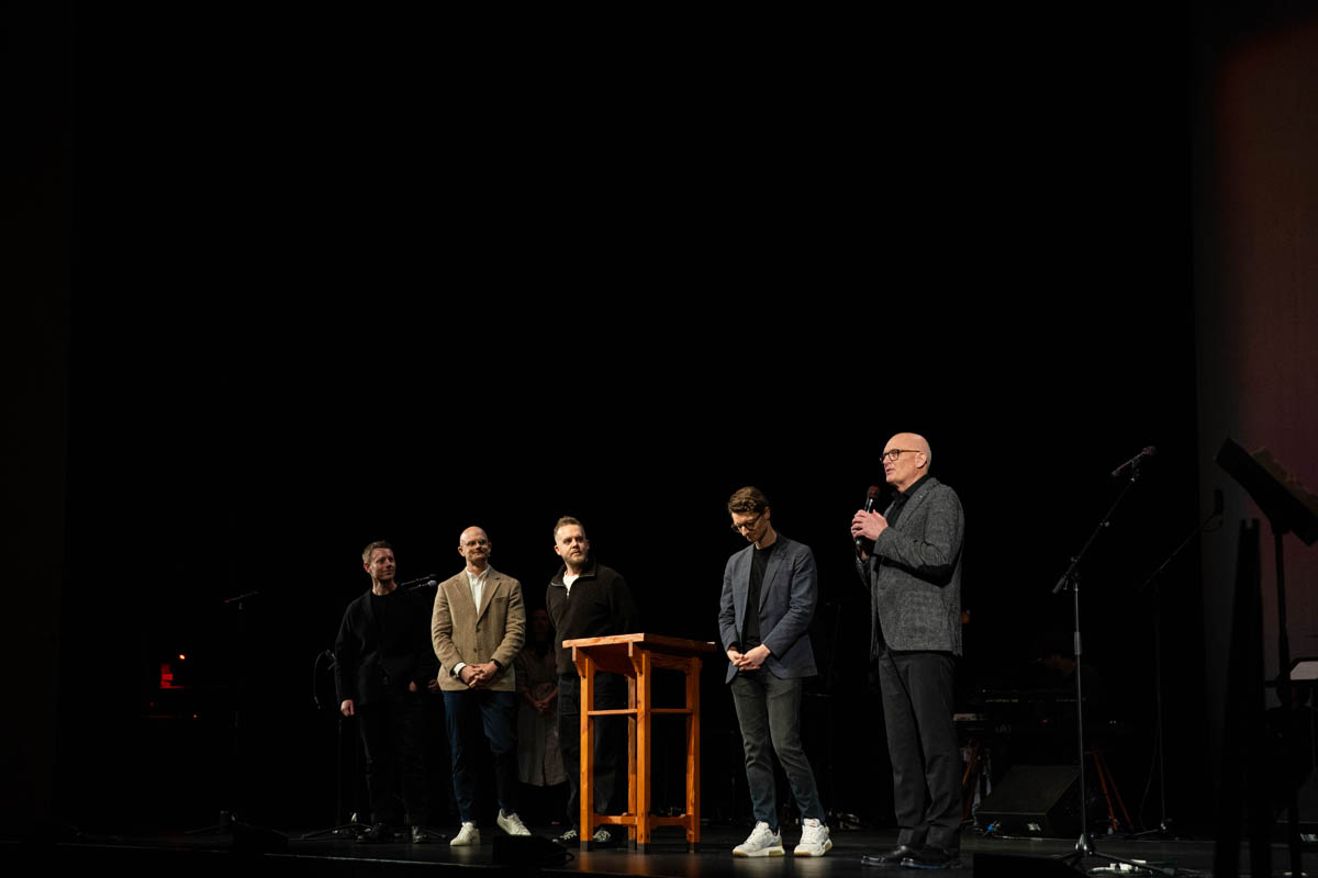 Church leaders addressing the congregation at a special event